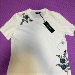 Embroidered White Top with Blue Floral Design